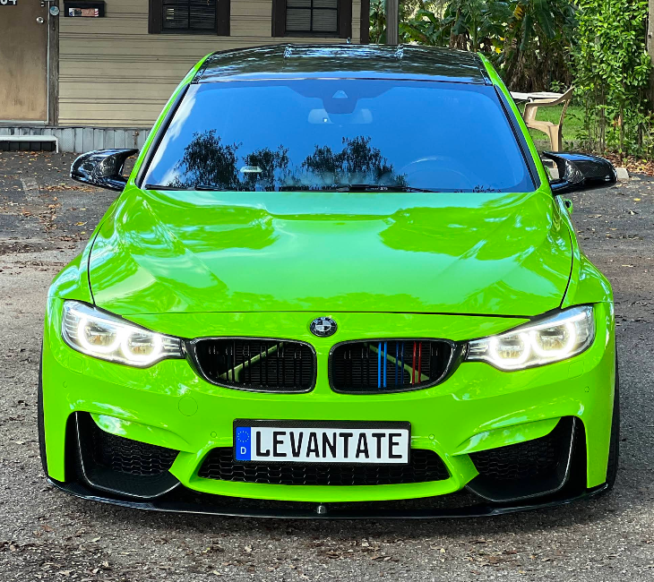 BMW M4 in bright green color change wrap