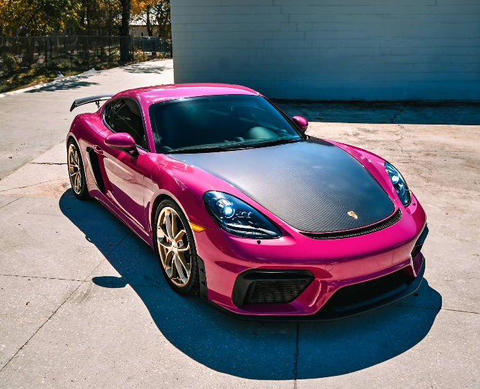 Porsche Cayman in pink color change with carbon fiber hood